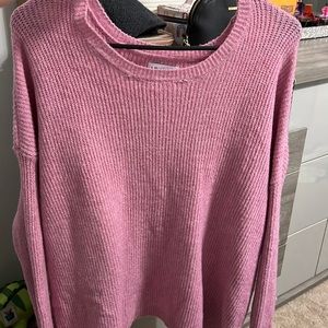 A pink sweater